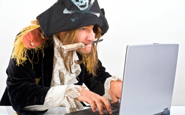 Pirate using laptop to write a talk